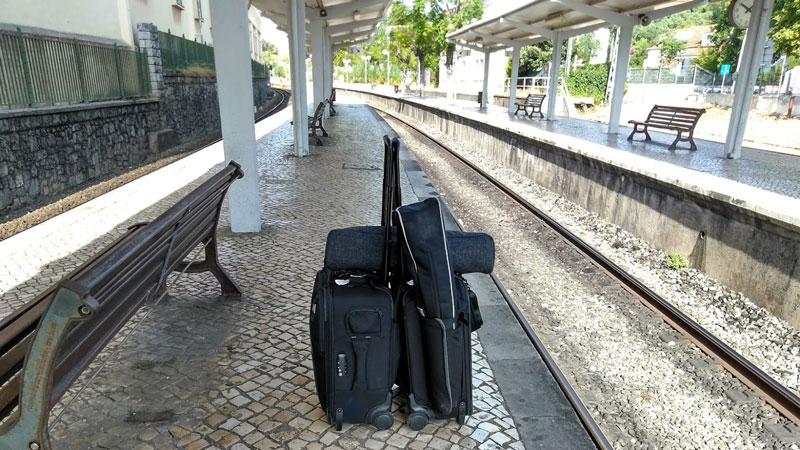 Filmmaking gear at train station platform.